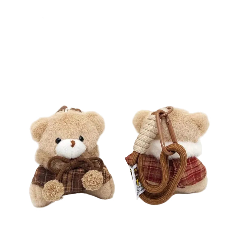Plush Bear Bag Charm, Caped Teddy in a Checked Cape on a Braided Cord, 19 cm Drop, Two Colours, styled in a nursery setting