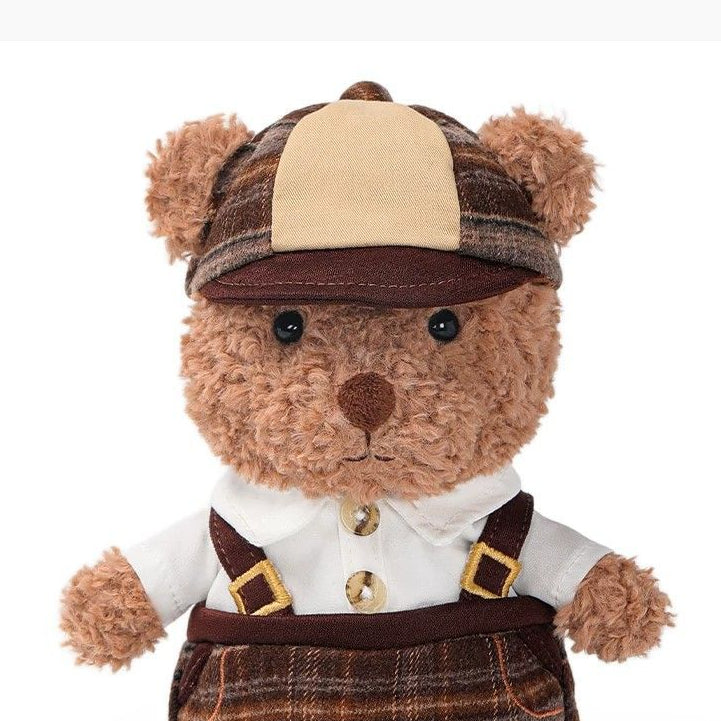 Teddy Bear Plush Toy in Vintage Outfit, Soft Stuffed Bear Doll with Cap & Suspenders, 18 cm, held in hand for scale
