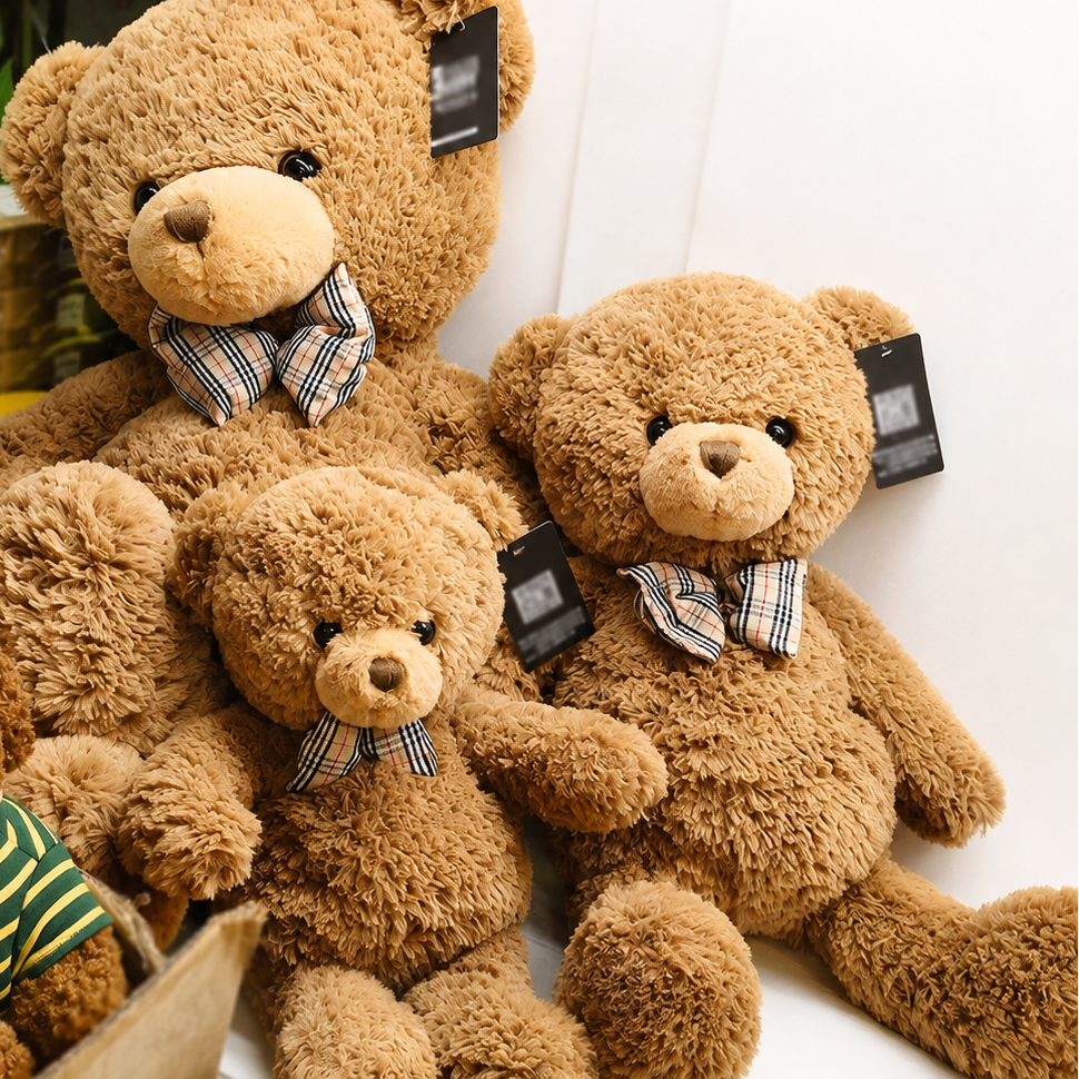 Classic Brown Teddy Bear Plush Toy, Soft Stuffed Bear with Bow Tie, held in hand for scale