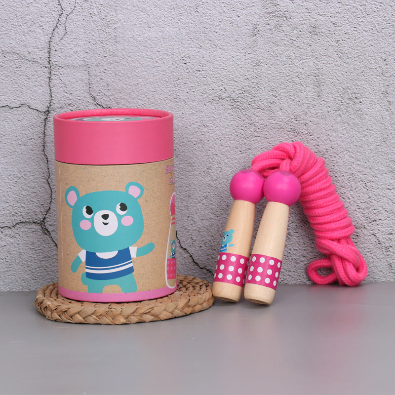 Bear wooden skipping rope with beech handles, shown with its kraft gift tube