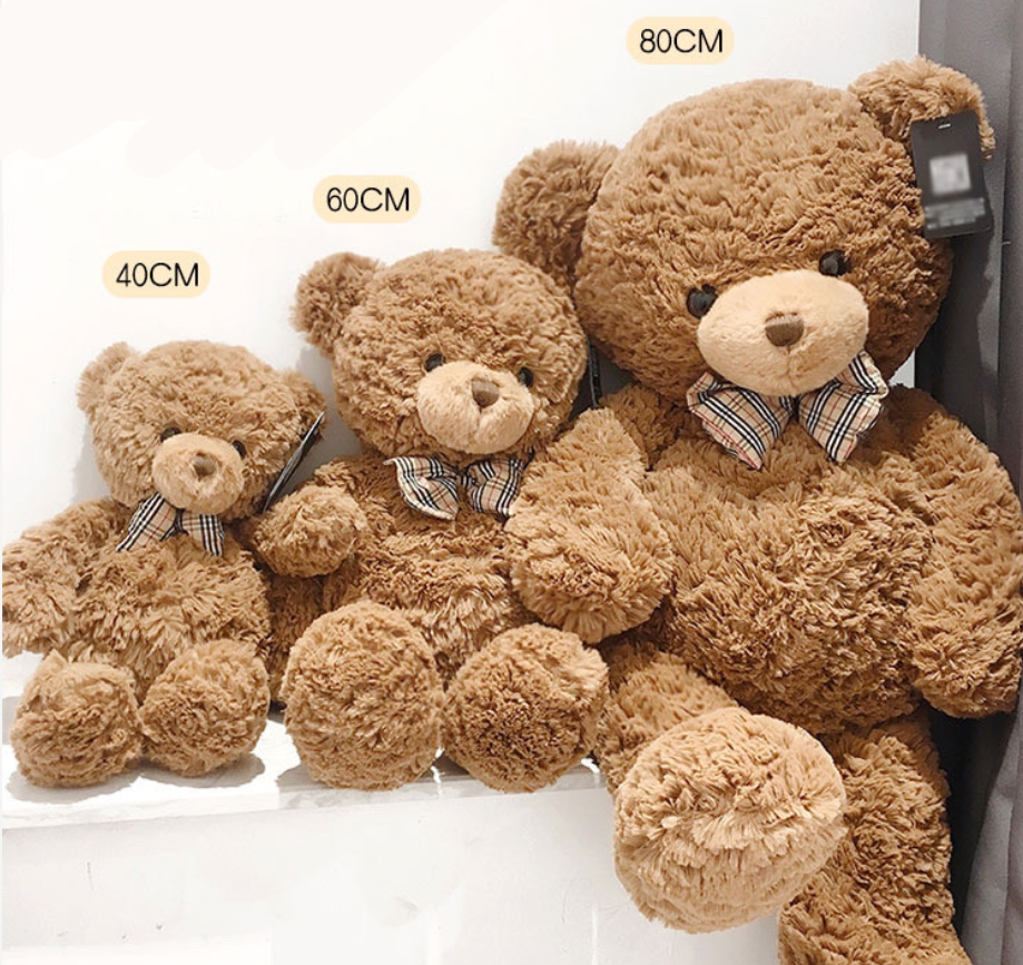 Classic Brown Teddy Bear Plush Toy, Soft Stuffed Bear with Bow Tie, styled in a nursery setting