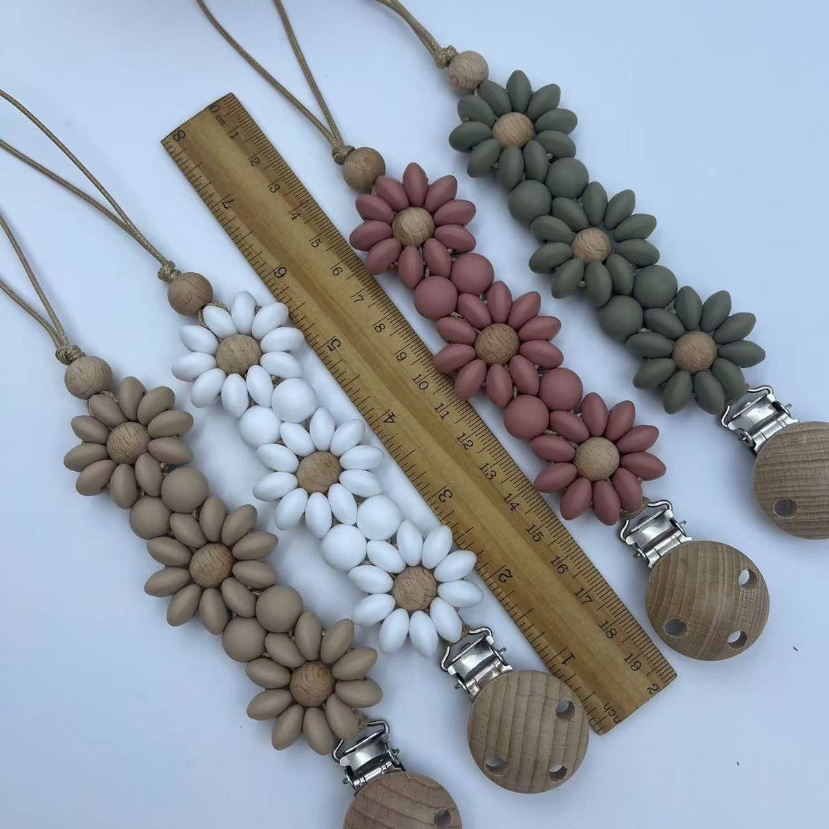 Silicone Flower Dummy Clip, Flat and Round Beads, shown with the full range