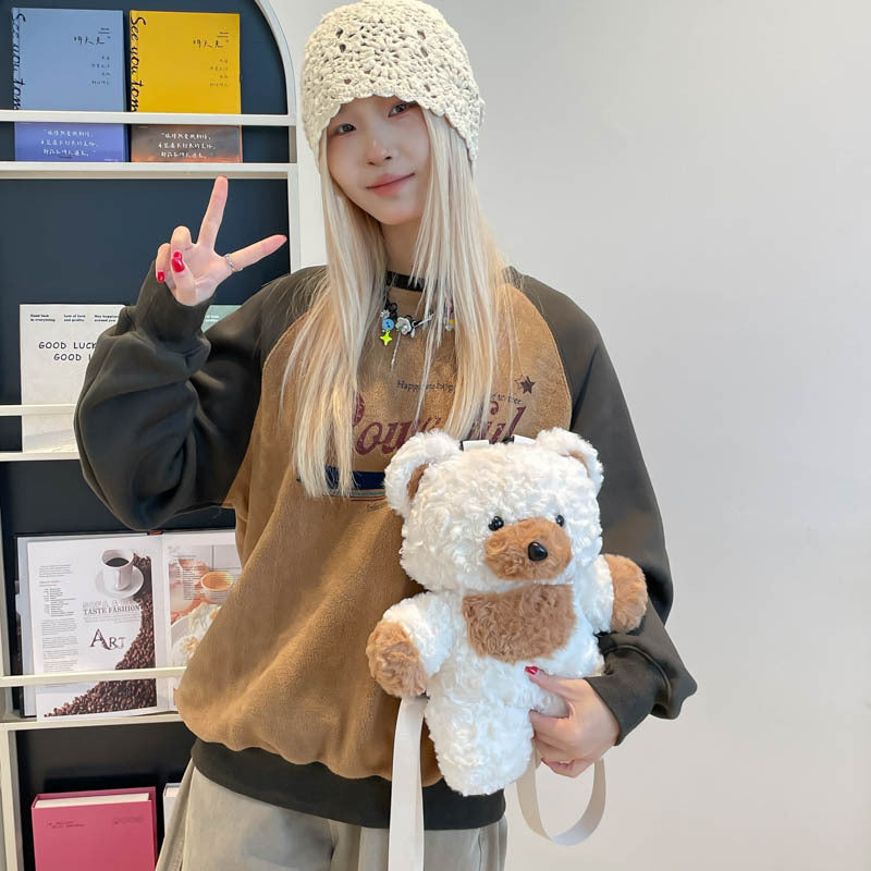 Teddy Bear Backpack, Plush Novelty Rucksack, held in hand for scale