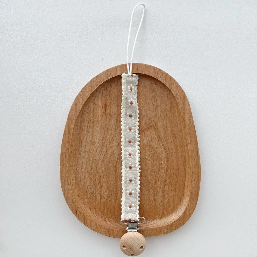 Floral Ribbon Dummy Clip, Lace Edge Soother Holder with Beech Wood Clip, 28.5 cm, 7 Designs, styled in a nursery setting